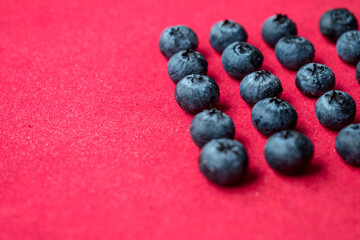 Fresh and healthy blueberries on a colorful surface at home  