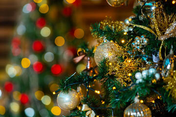 Fototapeta na wymiar Christmas tree with decorations and colorful light bulbs