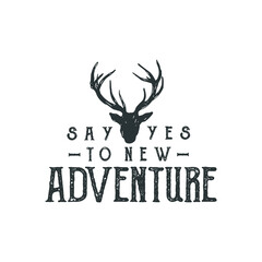 Hand drawn wilderness badge with mountain landscape and inspiring lettering 