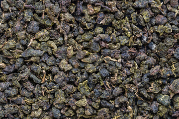 Green tea leaves background and texture, macro shot