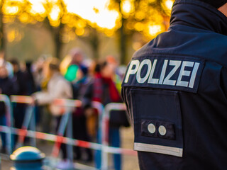 A police officer secures a demonstration in Berlin - obrazy, fototapety, plakaty