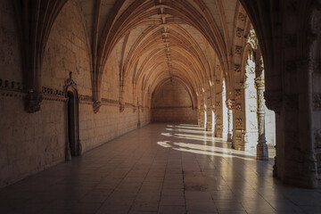 Fototapeta premium Archway of an old monastery. Cloisters of Jeronimos Monastery. Lisbon Portugal