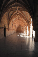 Archway of an old monastery. Cloisters of Jeronimos Monastery. Lisbon Portugal
