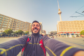 happy tourist man take selfie photo in Berlin city, Germany