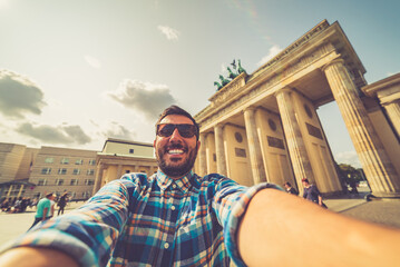 happy tourist man take selfie photo in Berlin city, Germany - obrazy, fototapety, plakaty