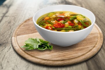 Bowl of delicious vegetable soup on a table