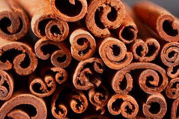 Fototapeta premium Cinnamon sticks on black background