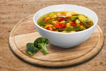 Bowl of delicious vegetable soup on a table