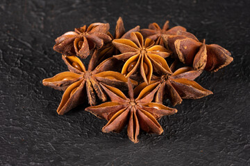 Star anise on black background
