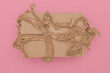 wrinkled parcel tape failed to packed up a brown cardboard box