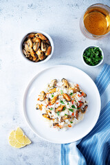 Mussel rice with pepper and parsley in a plate