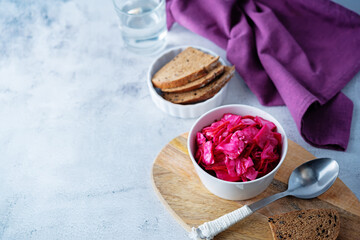 Fresh raw pickled beet cabbage with casrrot in a bowl