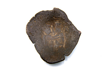 Antique copper coin of Byzantium on a white background