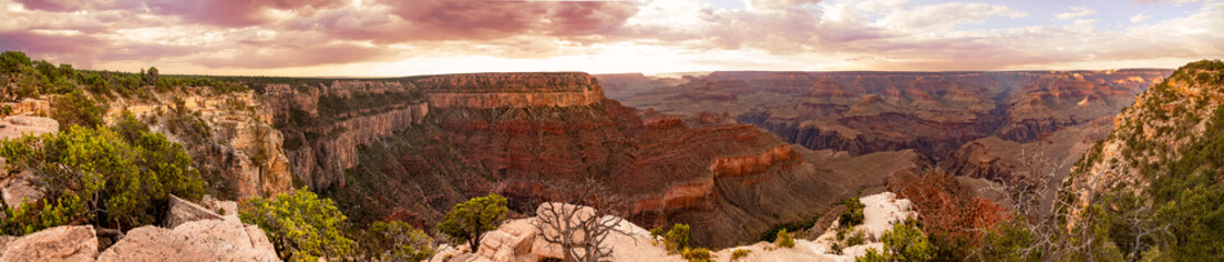 grand canyon panorama with red earth at valley and red sky on horizon