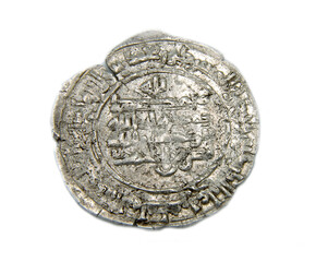 silver ancient arabic coin on white background
