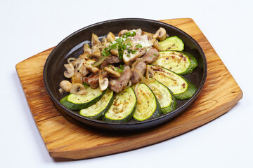 meat with vegetables on the white