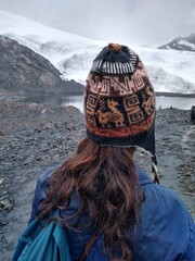 Girl - Pastoruri Glacier in Cordillera Blanca in the Andes mountain range near Huaraz, Peru, South America. The tropical glacier lies 5250 meters above sea level, in Huascaran National Park.