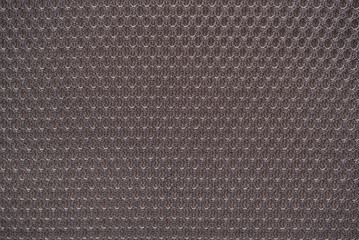 Grey nylon fabric textured background with hexagonal shape