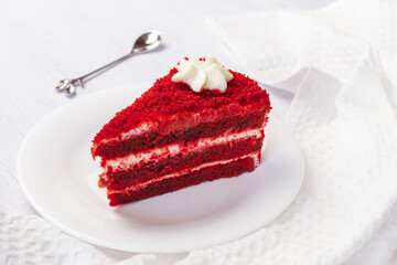 Red Velvet Cake sliced in piece on white plate on white background for celebrate X'mas season or Valentines day