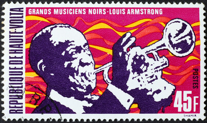 Louis Armstrong playing trumpet on postage stamp