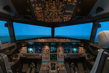 modern airplane cockpit  in a full flight simulator - a state of the art training device  - obrazy, fototapety, plakaty