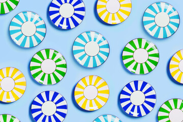 Set of color plates with a stripes pattern on blue background. Pattern	