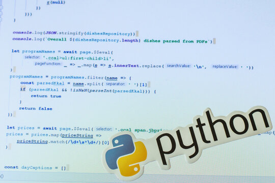 Moscow, Russia - 1 June 2020: Python logo sign with program code on background Illustrative Editorial