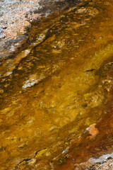 Brown and Yellow Stone Underneat h Flowing Geyser