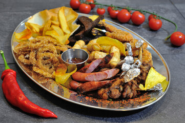 Delicious, beautiful, fresh salad in a plate on a wooden restaurant table