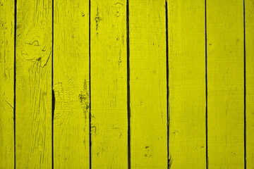 Wood with yellow paint. With plank texture wall background. Through use wash giving a feeling of looking old and beautiful.