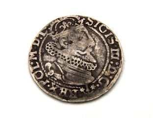 medieval European silver coin on white background