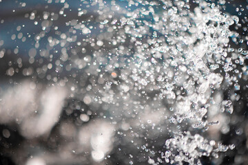 Water drops from the fountain. Abstraction from water. Water droplets background.