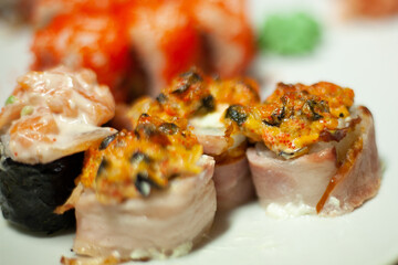 Slightly blurred Sushi beautifully decorated dish on the table