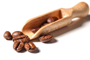 Heap of fresh roasted coffee beans isolated on white background as package design elements