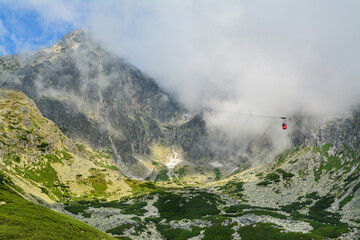 Red cable car from the Tatra Mountains to the Lomnicky Peak. Beautiful mountain landscape in Slovakia.