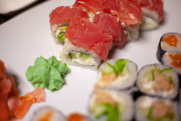 Slightly blurred Sushi beautifully decorated dish on the table