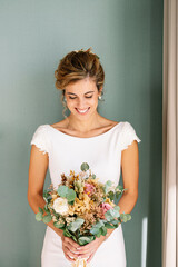 Bride to be married with bouquet of flowers