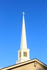 church steeple against blue sky  in Sterling Kansas USA. That's bright and colorful.