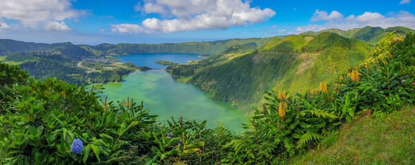 Panorama landscape with clouds and blue sky from the volcanic crater lake of Sete Citades in Sao Miguel Island of Azores Portugal