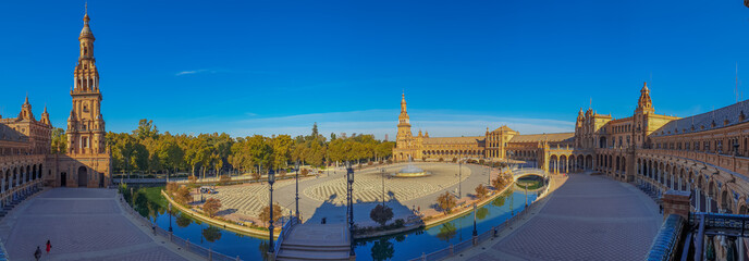 Panorama of Plaza de Espana, spain square, Sevilla, Andalusia, Spain, Europe. with water and blue sky