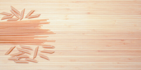 pasta in the kitchen on a wooden background