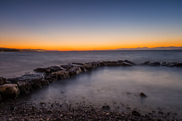 Croatia, Brac island, beach Supetrus at sunset near Supetar. August 2020. Long exposure picture.