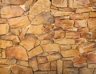 The wall is lined with large brown stones