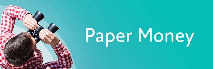 Naklejka premium Paper Money. Man observing with binoculars. Focus on text/word. Panorama format. Blue/turquoise background.