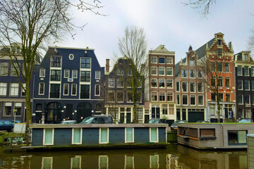 city ​​panorama of the metropolitan city of amsterdam between ancient buildings and river channels