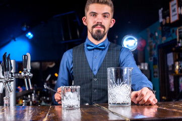 Bartender creates a cocktail at the taproom