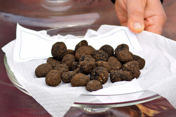 Group of black truffles in Italian market.