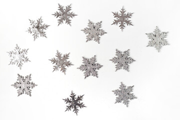 Silver color christmas snowflakes isolated on white