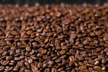 Coffee beans background. Macro shot with bokeh background