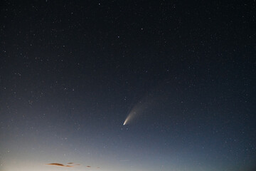 Starry night sky with a falling star